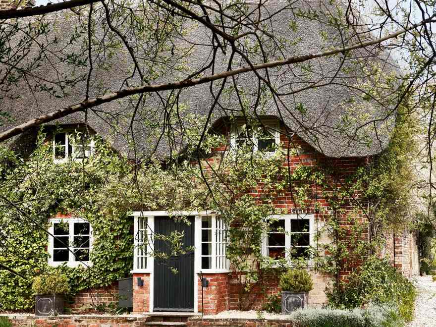 This historic thatched cottage within the nation is image excellent inside and outside